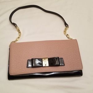 Tan and black clutch with gold accents